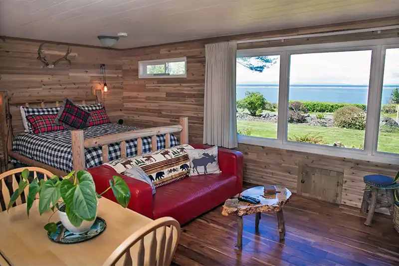 The Sunset Log Cabin Room looking out at the water